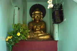 A Buddha statue in one of the small shrines of the above pagoda.